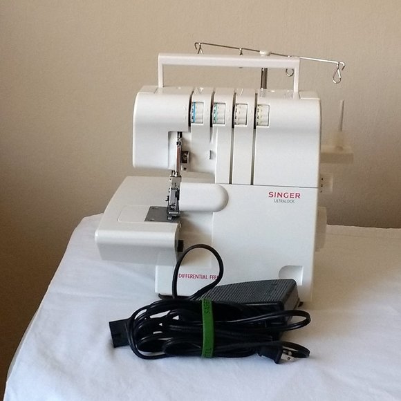 Singer electric serger sewing machine - Picture 1 of 5
